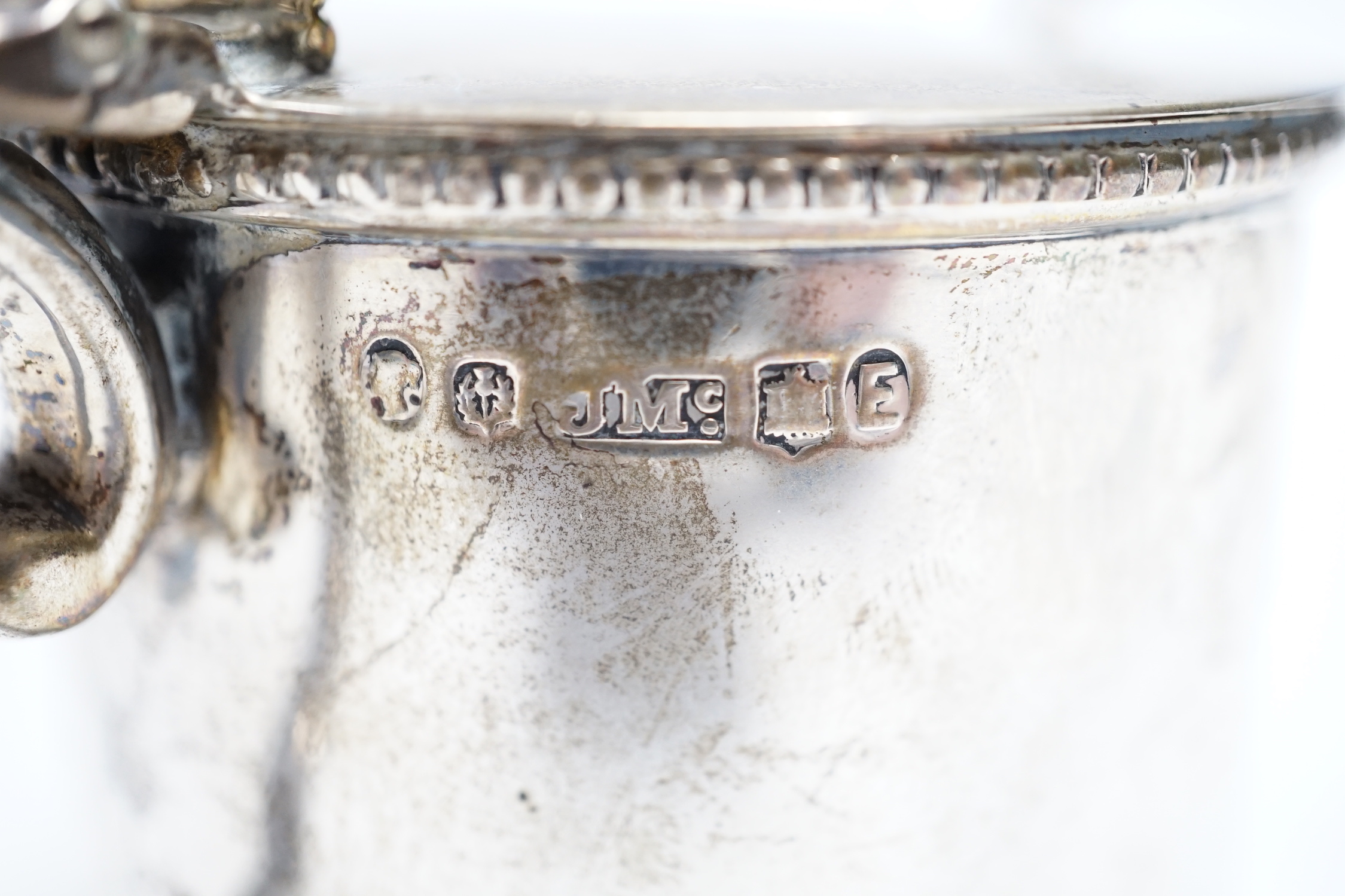 A Victorian Scottish silver drum mustard, James McKay, Edinburgh, 1861, height 72mm, with an earlier associated silver spoon